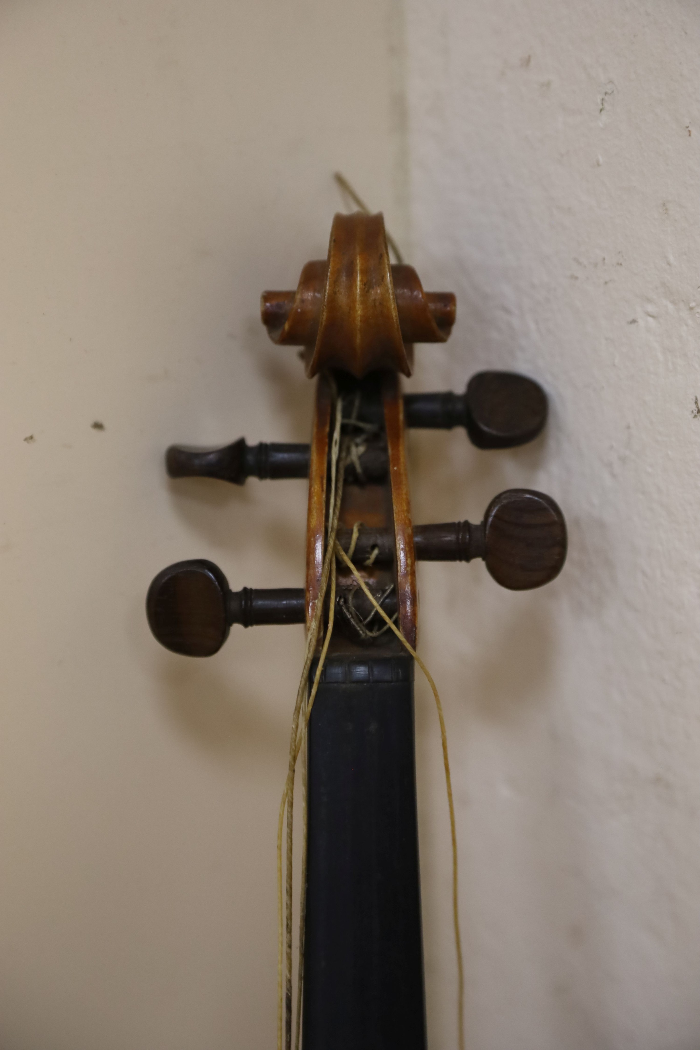 A Stradivarius copy violin and two bows and another bow, both cased, backs 33cm and 30cm